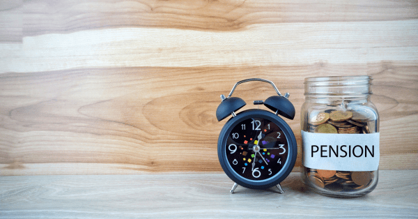 Pensions and retirement concept with a jar of coins labeled "Pension" and an alarm clock, symbolizing time and savings for future security.